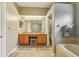 Well-lit bathroom with dual sinks and vanity at 10161 Sandy Marsh Ln, Orlando, FL 32832