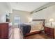 Bedroom featuring wood floors and an elevated display space at 10161 Sandy Marsh Ln, Orlando, FL 32832