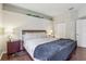Bedroom featuring wood floors and a closet for storage at 10161 Sandy Marsh Ln, Orlando, FL 32832