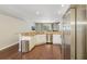 Open kitchen with granite countertops, stainless steel appliances and access to outdoor spaces at 10161 Sandy Marsh Ln, Orlando, FL 32832