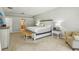Bright main bedroom featuring a king bed and ensuite bathroom at 10161 Sandy Marsh Ln, Orlando, FL 32832