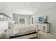 Sunny main bedroom offering a king bed and access to backyard at 10161 Sandy Marsh Ln, Orlando, FL 32832