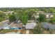 Aerial view of the backyard features a shed, fire pit, and garden beds at 1094 Henry Balch Dr, Orlando, FL 32810