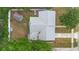 An aerial view reveals the backyard's shed, firepit, and garden at 1094 Henry Balch Dr, Orlando, FL 32810