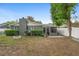 Private backyard featuring a screened in lanai, brick fire pit, and partial fencing at 1094 Henry Balch Dr, Orlando, FL 32810