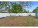 Fenced backyard featuring raised garden beds and a hammock offers an outdoor retreat at 1094 Henry Balch Dr, Orlando, FL 32810