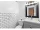 Modern bathroom showcasing subway tile backsplash and a sleek gray vanity with ample storage at 1094 Henry Balch Dr, Orlando, FL 32810