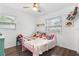 Bright bedroom with a playful atmosphere, featuring a pink metal bed and fun decor at 1094 Henry Balch Dr, Orlando, FL 32810