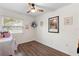 Bedroom featuring hardwood flooring, natural lighting, and ample space at 1094 Henry Balch Dr, Orlando, FL 32810