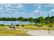 Scenic lake view with a bench and recreation area, perfect for enjoying peaceful outdoor moments at 1094 Henry Balch Dr, Orlando, FL 32810