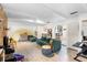 Bright living room with wood floors, exposed beams, and a cozy seating arrangement at 1094 Henry Balch Dr, Orlando, FL 32810