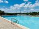 Inviting community swimming pool with clear blue water and ample lounge seating for relaxing poolside at 1094 Henry Balch Dr, Orlando, FL 32810