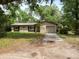 Exterior view of a single-story house with a garage and grassy front yard on a sunny day at 111 Beasley Rd, Oviedo, FL 32765