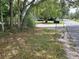 Street view of land with sparse grass and address marker, with car parked behind at 111 Beasley Rd, Oviedo, FL 32765