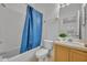 Bathroom with shower tub, vanity, toilet, and neutral decor at 1150 Vineland Pl, Lake Mary, FL 32746