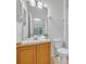 Cozy bathroom features a vanity and a shower tub with curtain at 1150 Vineland Pl, Lake Mary, FL 32746