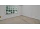 Neutral bedroom with a large window providing plenty of natural light at 1150 Vineland Pl, Lake Mary, FL 32746