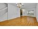 Spacious living room with hardwood floors, chandelier, and bright natural light at 1150 Vineland Pl, Lake Mary, FL 32746