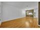 Open-concept living room with hardwood floors and a view of the kitchen at 1150 Vineland Pl, Lake Mary, FL 32746