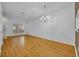 Bright living room featuring hardwood floors and a stylish chandelier at 1150 Vineland Pl, Lake Mary, FL 32746