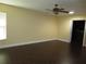 Bedroom showcasing dark floors and a ceiling fan for added comfort at 11540 Sandy Hill Dr, Orlando, FL 32821