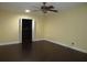 Bedroom with hardwood floors and a closet space with built in shelving at 11540 Sandy Hill Dr, Orlando, FL 32821