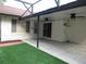 Covered outdoor patio with dual ceiling fans, perfect for outdoor relaxation and entertaining at 11540 Sandy Hill Dr, Orlando, FL 32821