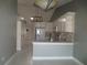 Well-lit kitchen with white cabinetry, a breakfast bar, and modern stainless appliances at 11540 Sandy Hill Dr, Orlando, FL 32821