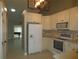 Spacious kitchen with white appliances and ample cabinet space at 11540 Sandy Hill Dr, Orlando, FL 32821