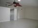 Open-concept living space featuring ceramic tile floors and a ceiling fan at 11540 Sandy Hill Dr, Orlando, FL 32821