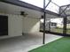 Spacious screened patio with a ceiling fan, offering an ideal outdoor living and entertainment space at 11540 Sandy Hill Dr, Orlando, FL 32821