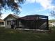 Exterior of the home's screened-in patio, providing an outdoor living area at 11540 Sandy Hill Dr, Orlando, FL 32821