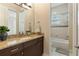 Bathroom with granite countertop vanity and a separate shower and tub at 11706 Waterstone Loop Dr, Windermere, FL 34786