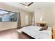 Bedroom features wood floors, a large window, and neutral colors at 11706 Waterstone Loop Dr, Windermere, FL 34786