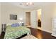 Bedroom with ceiling fan, hardwood floors, and ensuite bathroom access at 11706 Waterstone Loop Dr, Windermere, FL 34786