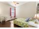 Bedroom with a large window, hardwood floors, and simple decor at 11706 Waterstone Loop Dr, Windermere, FL 34786