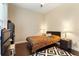 Bedroom featuring hardwood floors, bedside tables and lamps at 11706 Waterstone Loop Dr, Windermere, FL 34786