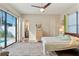 Bright bedroom with sliding glass doors to the pool and easy access to the en-suite bathroom at 11706 Waterstone Loop Dr, Windermere, FL 34786