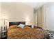 Cozy bedroom with bedside lamps, neutral walls, and hardwood floors at 11706 Waterstone Loop Dr, Windermere, FL 34786
