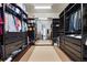 Walk-in closet with custom shelving, ample storage, and plenty of space at 11706 Waterstone Loop Dr, Windermere, FL 34786