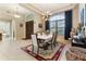An elegant dining room with a modern chandelier and large window at 11706 Waterstone Loop Dr, Windermere, FL 34786