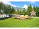 Waterstone community entrance featuring stone signage, a decorative gazebo and bridge over a stone water feature at 11706 Waterstone Loop Dr, Windermere, FL 34786