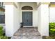 Close up of the beautiful, stately double front doors framed by grand white columns at 11706 Waterstone Loop Dr, Windermere, FL 34786