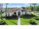 Inviting single-story home with manicured landscaping and a paver walkway leading to the front door at 11706 Waterstone Loop Dr, Windermere, FL 34786