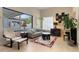 Relaxing living room with an oversized window and light, comfortable seating at 11706 Waterstone Loop Dr, Windermere, FL 34786