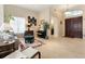 Inviting living room with tile floors, neutral decor, and ample natural light at 11706 Waterstone Loop Dr, Windermere, FL 34786