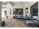 Outdoor patio with seating and travertine floors, offering a relaxing space for entertaining guests at 11706 Waterstone Loop Dr, Windermere, FL 34786