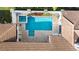 Aerial view of the pool and spa, surrounded by a brick paver patio and lush landscaping at 11706 Waterstone Loop Dr, Windermere, FL 34786