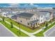 Aerial view of a charming two-story home with a landscaped yard in a suburban neighborhood at 11807 Charades St, Orlando, FL 32832