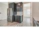 Modern kitchen featuring stainless steel appliances and dark cabinets at 11807 Charades St, Orlando, FL 32832